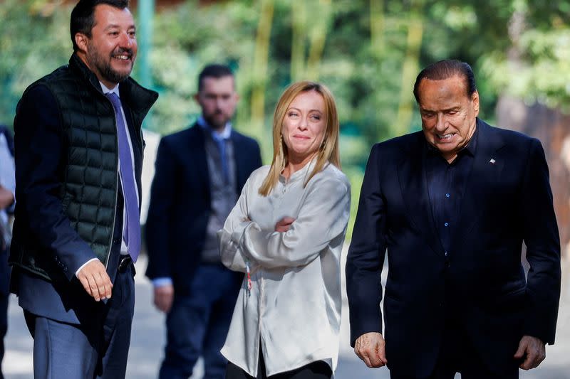 FILE PHOTO: Former Italian Prime Minister and leader of the Forza Italia party Silvio Berlusconi reacts at the end of a meeting with League leader Matteo Salvini and Brothers of Italy leader Giorgia Meloni in Rome