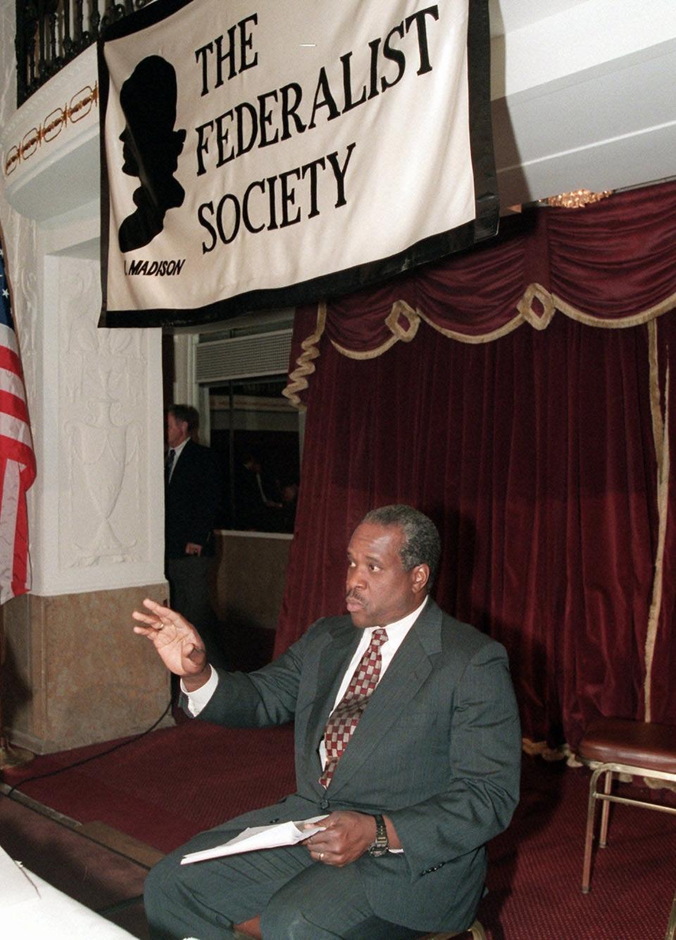 Supreme Court Justice Clarence Thomas addresses the Federalist Society in 1995 in Washington. Thomas spoke about how the concepts of victimhood and group rights have affected public debate and decision-making. Thomas has served on the court since 1991.