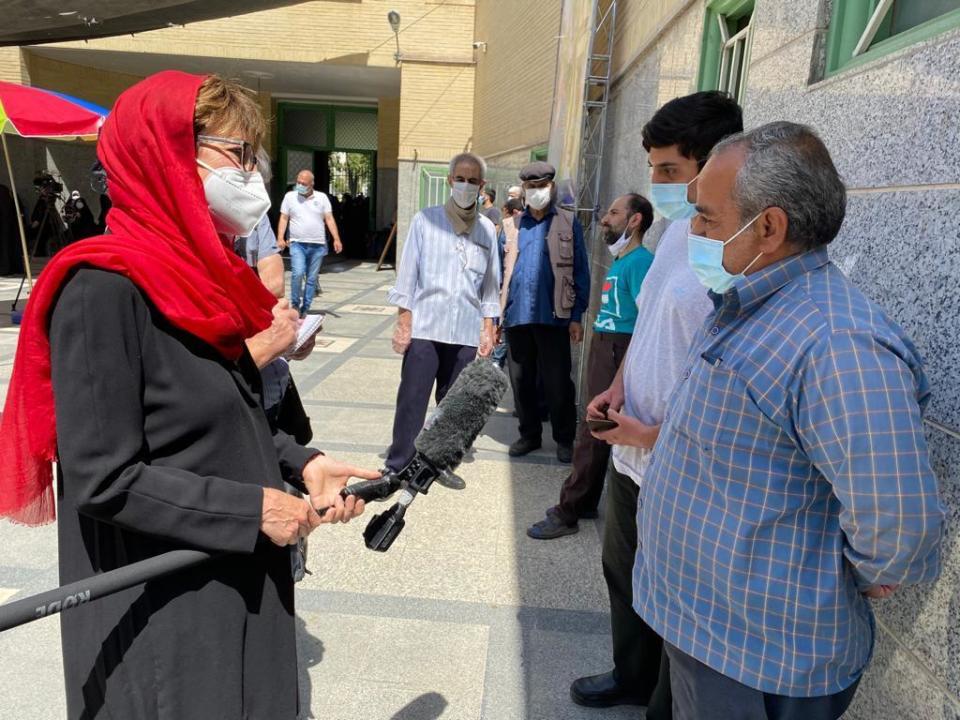 CBS News' Elizabeth Palmer speaks to Iranians at a polling station in Tehran, Iran, as they come to cast their ballots in the country's presidential election, June 18, 2021. / Credit: CBS