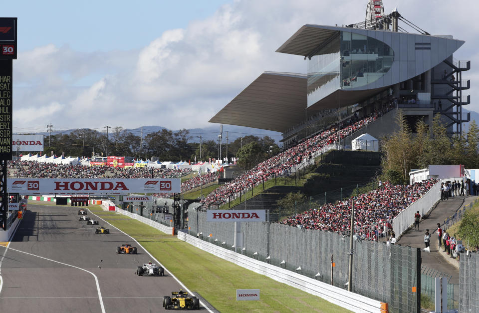 FILE - In this Oct. 7, 2018, file photo, debris falls from Sauber driver Charles Leclerc, second right, of Monaco's car during the Japanese Formula One Grand Prix at the Suzuka Circuit in Suzuka, central Japan. The 2021 Japanese Grand Prix has been canceled following discussions between the government and race promoters, Formula One organizers said Wednesday, Aug. 18, 2021.(AP Photo/Ng Han Guan, File)