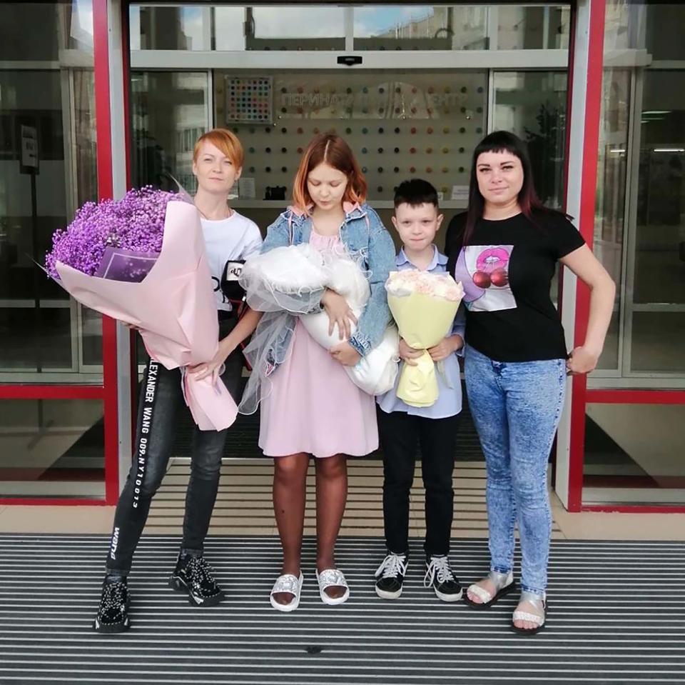 Darya Sudnishnikova, 15, Vanya, 10, and their mums. Source: East2West/Australscope