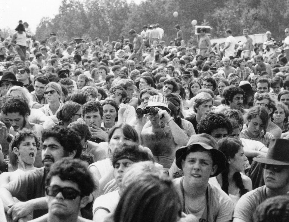 FILE - This 1969 file photo shows the crowd at the Woodstock Music and Arts Festival held on a 600-acre pasture in the Catskill Mountains near White Lake in Bethel, N.Y.,  (AP Photo, file)