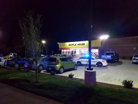 FILE PHOTO: A police vehicle sits parked at the scene of a fatal shooting at a Waffle House restaurant near Nashville, Tennessee, U.S., April 22, 2018. Metro Nashville Police Department/Handout via REUTERS