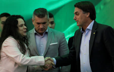 Federal deputy Jair Bolsonaro (R) greets Lawyer Janaina Paschoal (L) during the national convention of the Party for Socialism and Liberation (PSL) where he is to be formalised as a candidate for the Presidency of the Republic, in Rio de Janeiro, Brazil July 22, 2018. REUTERS/Ricardo Moraes