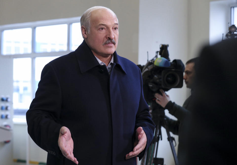 Belarusian President Alexander Lukashenko speaks to journalists as he visits the Dobrush Paper Factory in Dobrush, Belarus, Tuesday, Feb. 4, 2020. Lukashenko boasted about Belarus' warmer ties with the United States as he prepared to meet with Russian President Vladimir Putin for another round of difficult economic talks. (Nikolai Petrov/BelTA Pool Photo via AP)