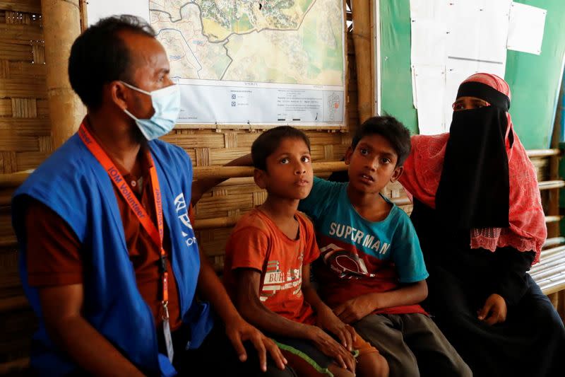 The Wider Image: 'Can't take this pain': Rohingya mother searches for son after refugee camp blaze