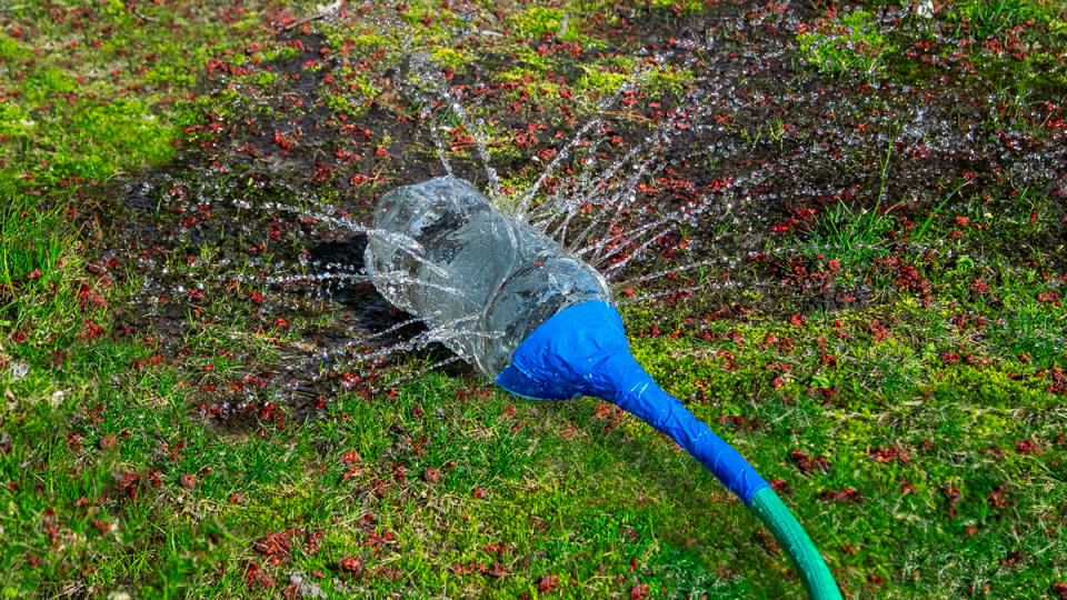 Making a DIY sprinkler is one of many uses for plastic bottles