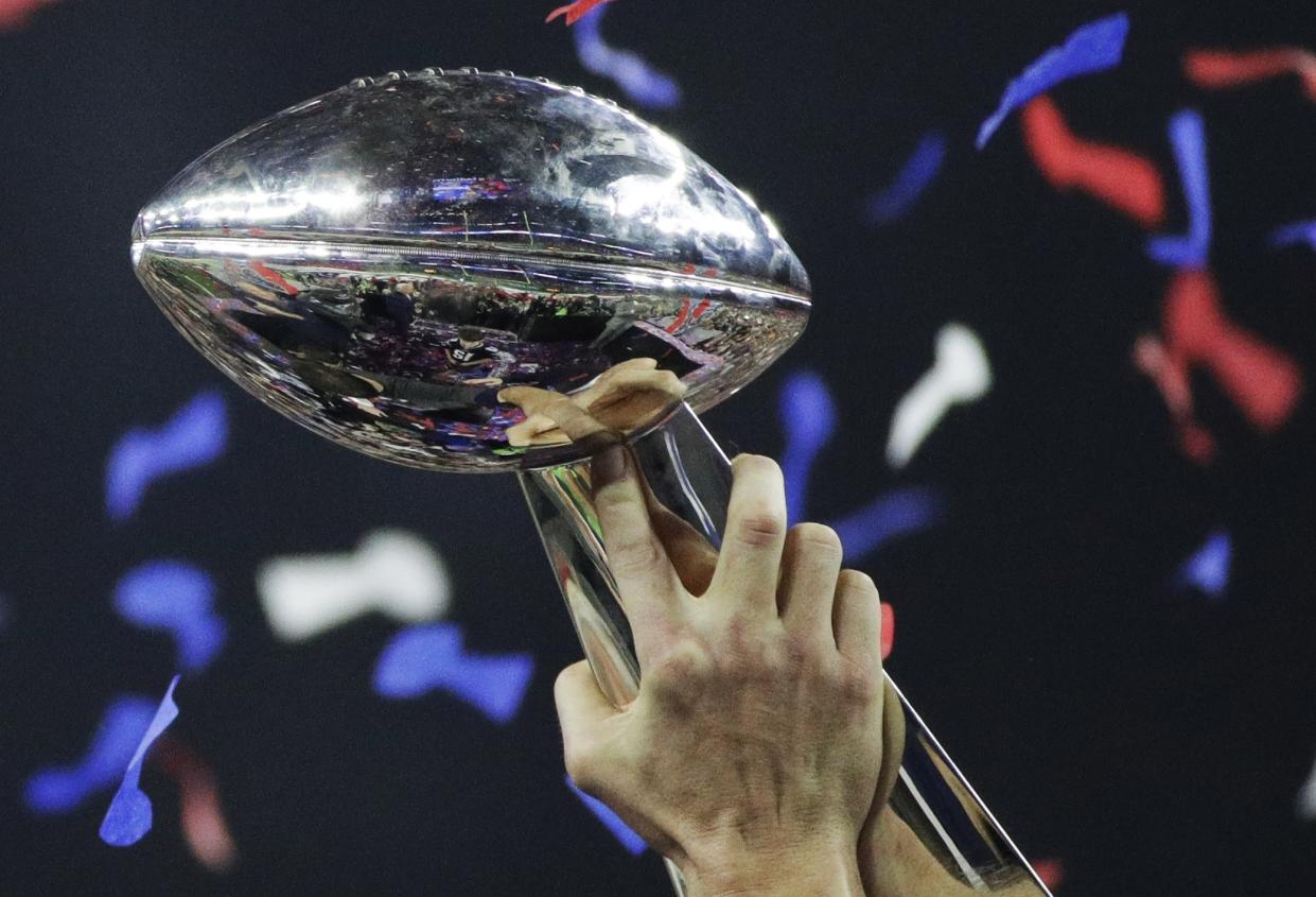 New England Patriots' Tom Brady holds the Vince Lombardi Trophy after winning the NFL Super Bowl 51 football game against the Atlanta Falcons, Sunday, Feb. 5, 2017, in Houston. (AP Photo/Jae C. Hong)