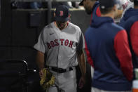 Boston Red Sox starting pitcher Michael Wacha walks through the dugout after giving up a two-run home run to Chicago White Sox's Andrew Vaughn, and being removed, during the fifth inning of a baseball game Thursday, May 26, 2022, in Chicago. (AP Photo/Charles Rex Arbogast)