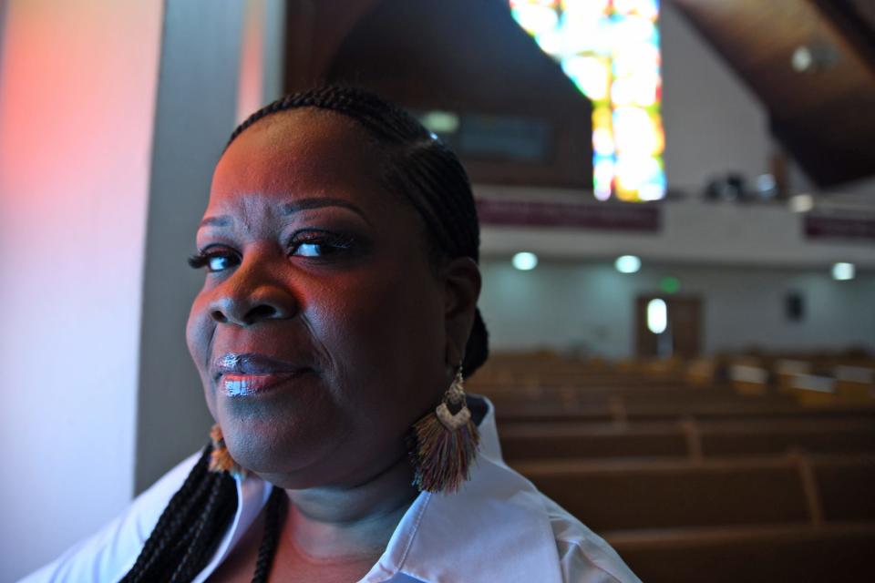 Ivy Butler pauses for a moment in early July in the church sanctuary at Power in Praise Crusade Ministries in Mishawaka, where she is senior pastor.
