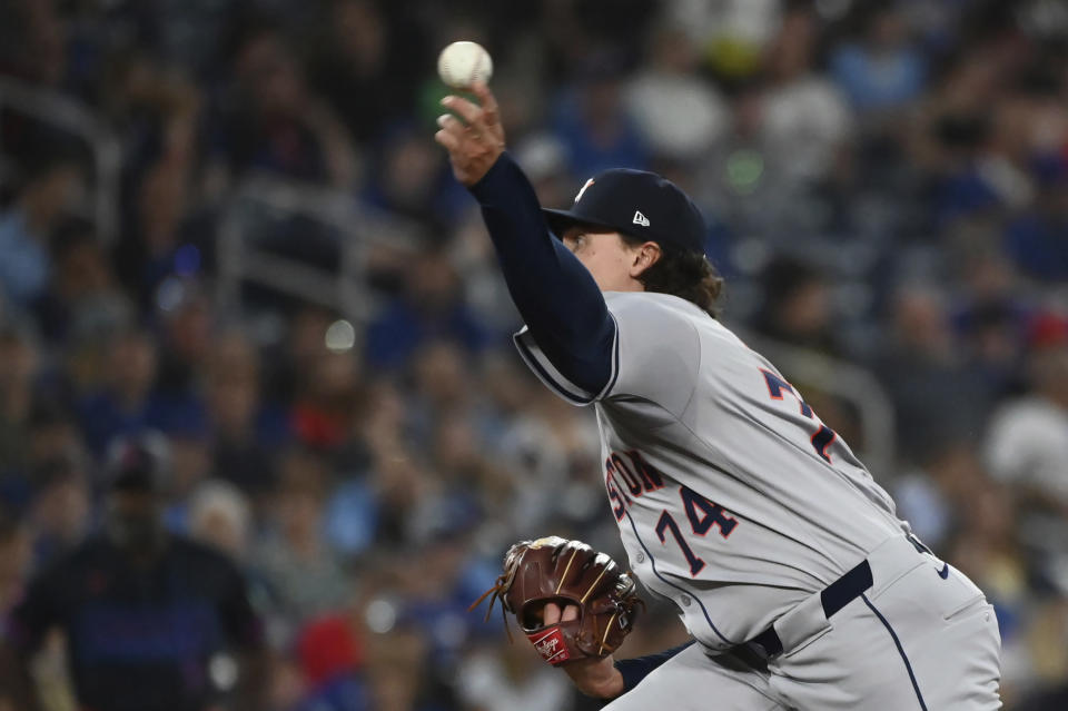 Houston Astros pitcher Bryan King (74) works against the Toronto Blue Jays during the eighth inning of a baseball game in Toronto on Wednesday, July 3, 2024. (Jon Blacker/The Canadian Press via AP)