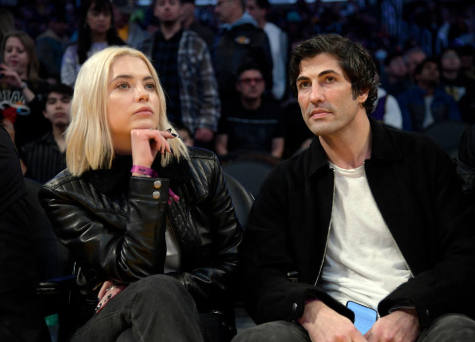 the two sitting courtside at a game