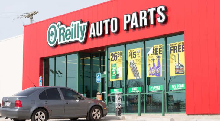 The logo for O'Reilly Auto Parts is displayed on a red building front.