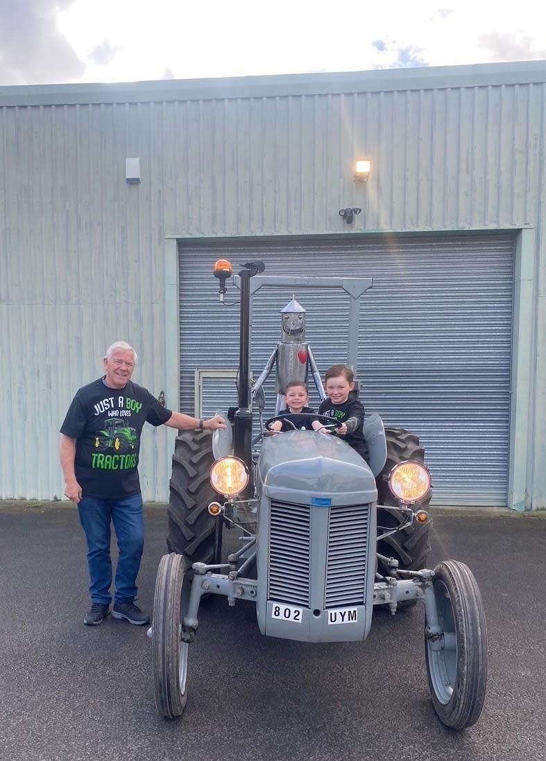 Darlington and Stockton Times: Bill Moody and his grandsons Joseph and Max on board the Fergie TEF20