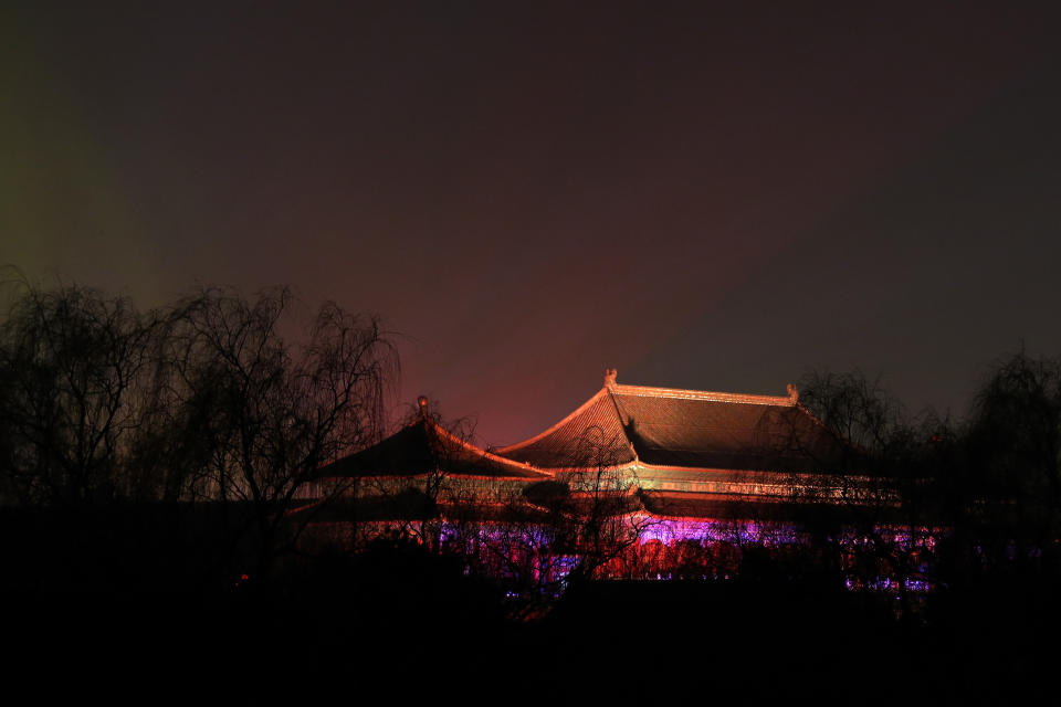 In this Tuesday, Feb. 19, 2019, photo, the Forbidden City is projected with colorful lights for the Lantern Festival in Beijing. China lit up the Forbidden City on Tuesday night, marking the end of 15 days of lunar new year celebrations. It was not a Lantern Festival the last emperor, who abdicated in 1912, would have recognized. There were lanterns, but those lucky enough to snag tickets saw a laser light show and historic buildings bathed in colorful lights. Others watched from outside the vast walled compound in Beijing, from where Ming and Qing dynasty emperors ruled for five centuries. (AP Photo/Andy Wong)