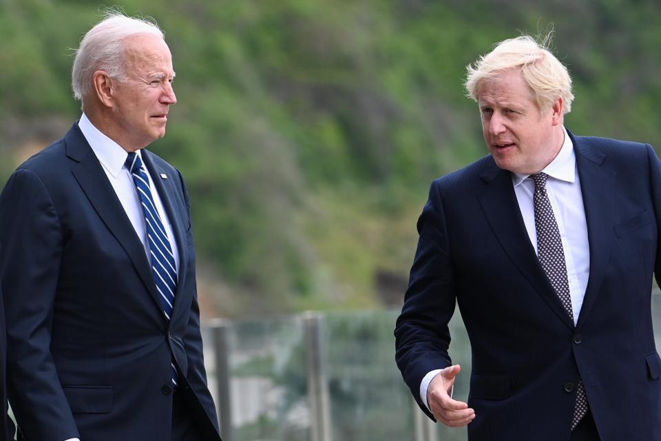 Biden and Johnson are pictured at the G7 summit earlier this year (PA)