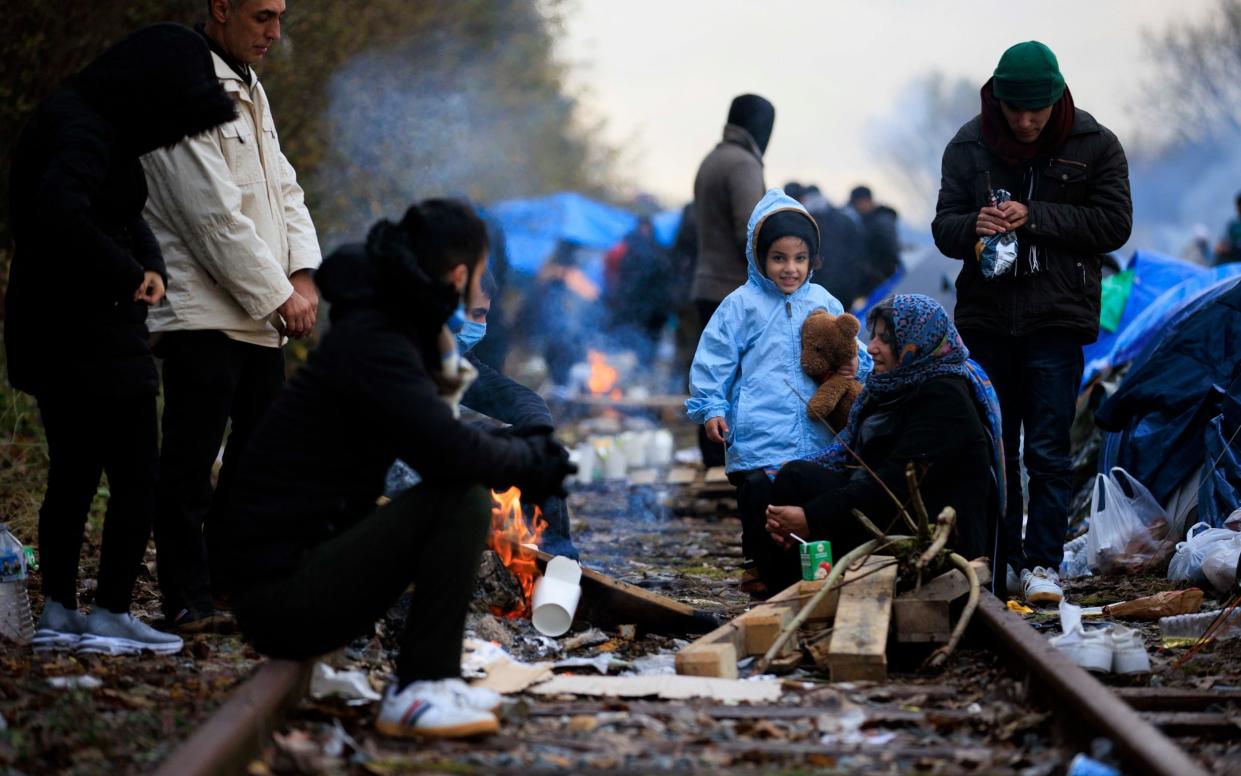 Four-year-old Mohammed Yadgar arrived at the Grande-Synthe camp, Dunkirk, with his family last week. They are living on a disused railway line - Jamie Lorriman