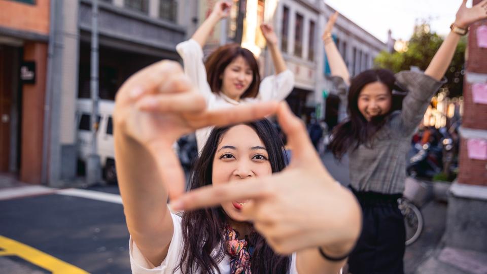 millennial friends jumping for photo