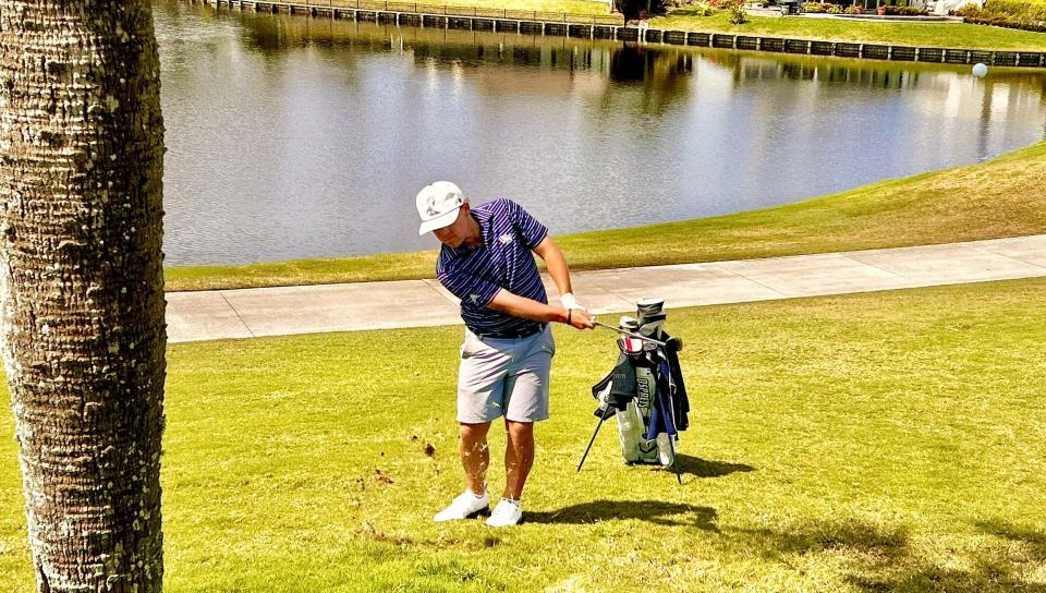 Jason Duff of the University of North Florida pitches onto the 18th green of the Sawgrass Country Club during Sunday's second round of The Hayt, the invitational college tournament hosted by UNF.