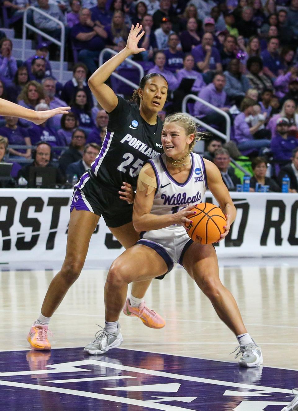 Kansas State guard Gabby Gregory (12) looks for an opening against Portland's Kioanna Hamilton (25) during Friday's NCAA Tournament first-round game at Bramlage Coliseum. Gregory led K-State with 22 poiints in a 78-65 victory.