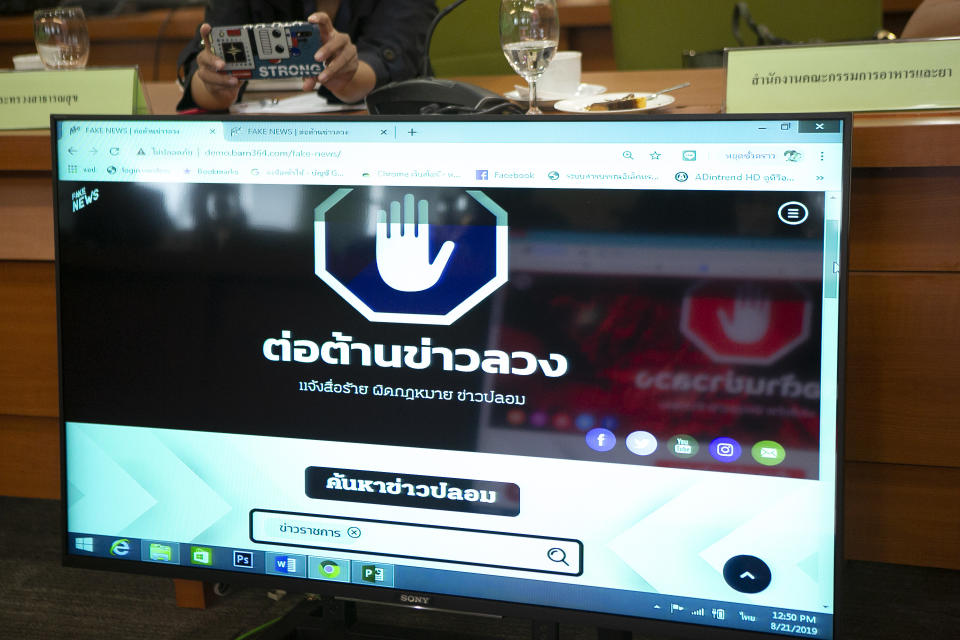 Demo default page of Thai government run anti-fake news center web portal is displayed on a screen in Bangkok, Thailand Wednesday, Aug. 21. 2019. Thailand's government has announced plans to set up a center to combat unverified and unauthenticated news on social media platforms. The words on the screen read; Prevent Fake News. (AP Photo/Pitcha Dangprasith)