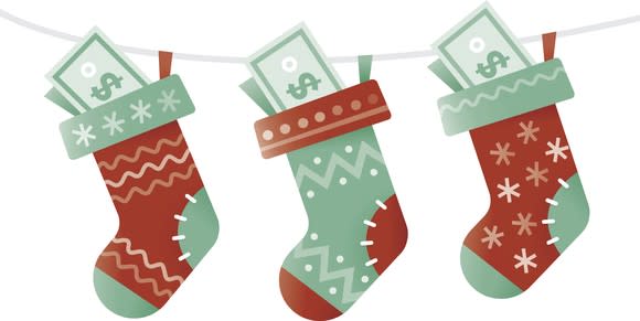 Three stockings with dollar bills in them.