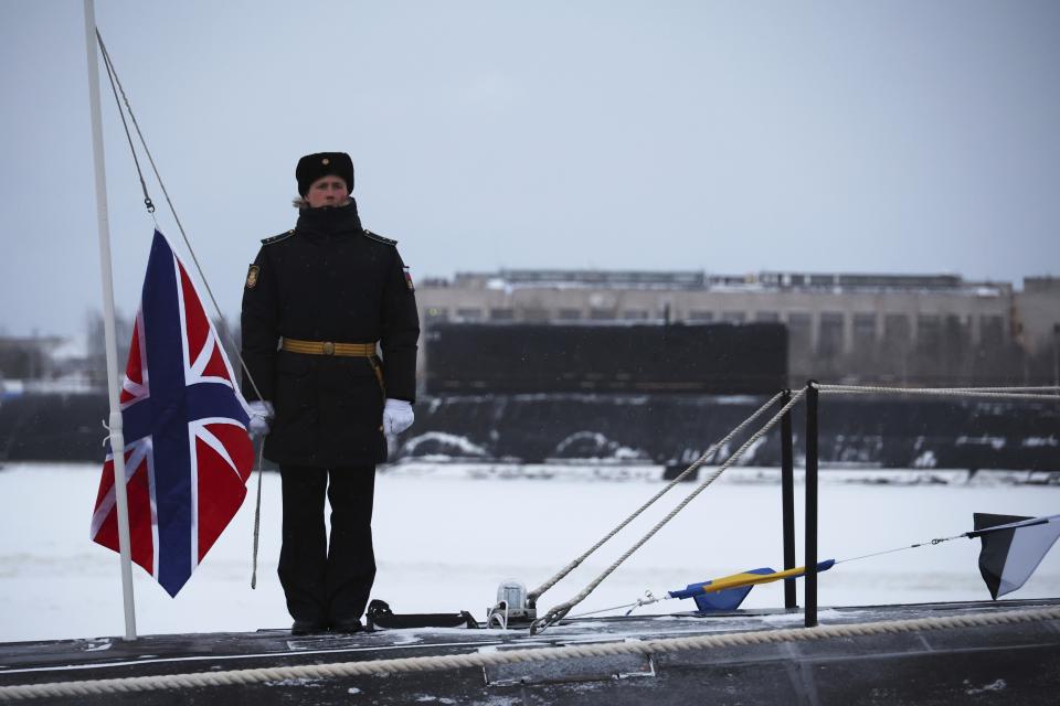 A Russian sailor stands on deck of the newly-built nuclear submarine The Emperor Alexander III as Russian President Vladimir Putin attends a flag-raising ceremony on Monday for newly-built nuclear submarines at the Sevmash shipyard in Severodvinsk in Russia's Archangelsk region, Monday, Dec. 11, 2023. The navy flag was raised on the Emperor Alexander III and the Krasnoyarsk submarines during Monday's ceremony. Putin has traveled to a northern shipyard to attend the commissioning of new nuclear submarines, a visit that showcases the country's nuclear might amid the fighting in Ukraine. (Mikhail Klimentyev, Sputnik, Kremlin Pool Photo via AP)