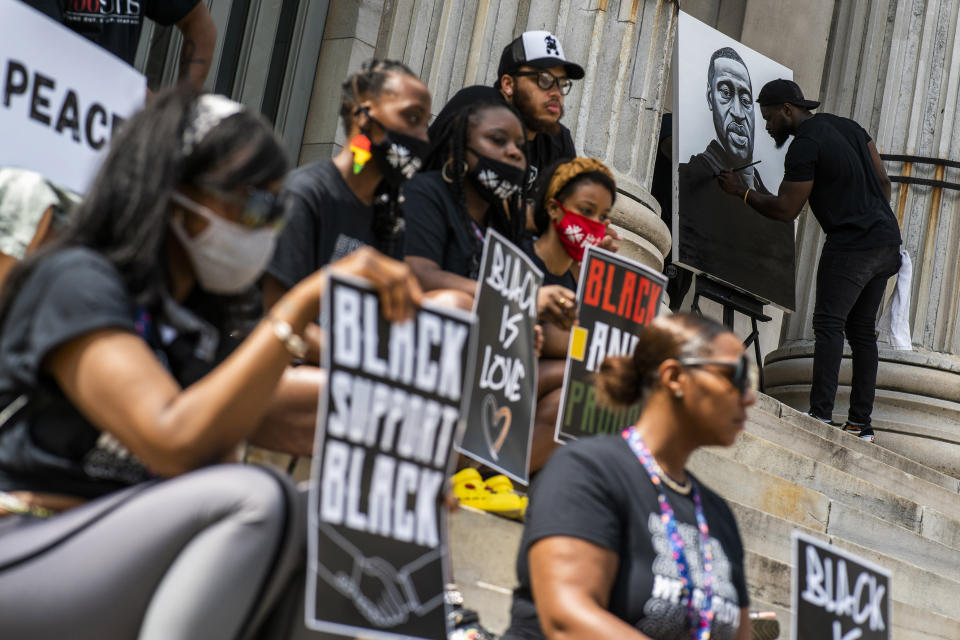 People attend a rally with Terrence Floyd, brother of George Floyd, on Sunday, May 23, 2021, in Brooklyn borough of New York. George Floyd, whose May 25, 2020 death in Minneapolis was captured on video, plead for air as he was pinned under the knee of former officer Derek Chauvin, who was convicted of murder and manslaughter in April 2021. (AP Photo/Eduardo Munoz Alvarez)