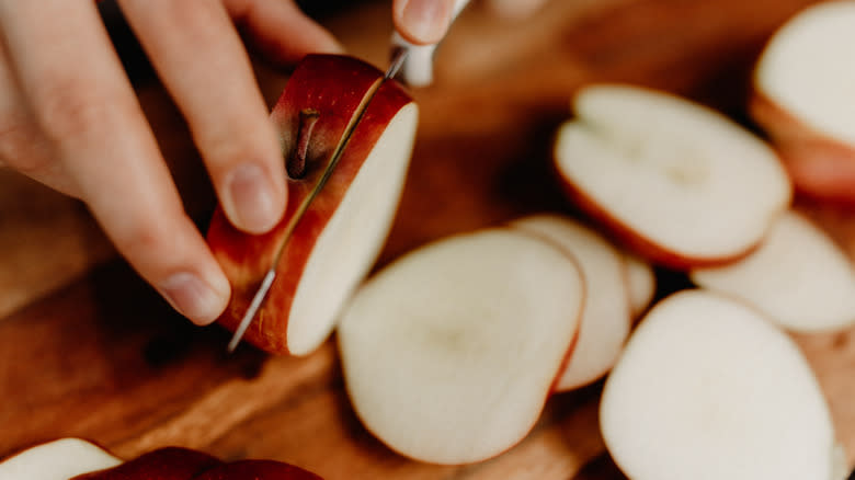 Person slicing apples