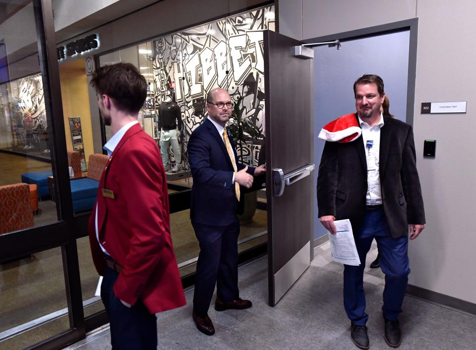Hendrick Health CEO and President Brad Holland holds the door for tour participants as they explore the new Hendrick Service Center at the Mall of Abilene Thursday, Nov. 30, 2023.