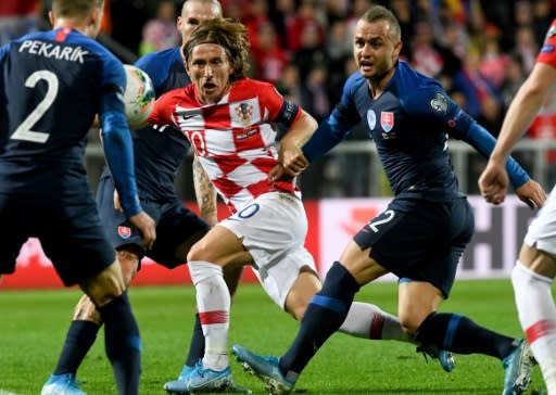 The 34-year-old Luka Modric (C) remains a central part of the Croatia team