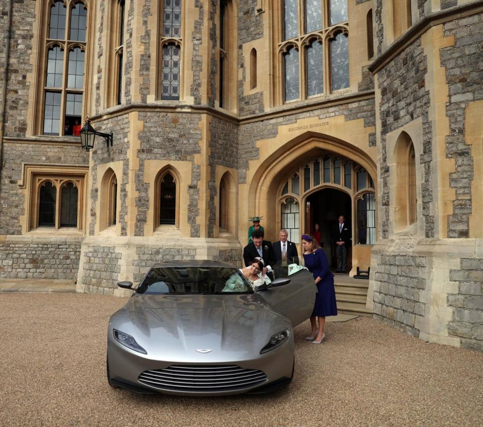 Princess Eugenie is driven off in a James Bond Aston Martin after her wedding (PA)