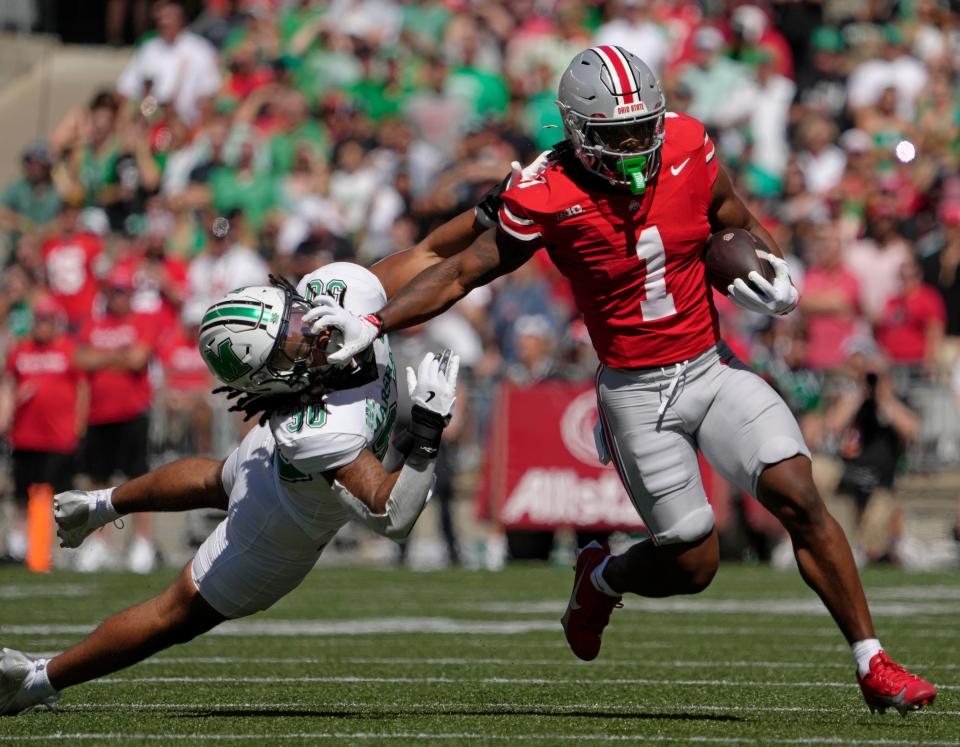 Sept. 21, 2024; Columbus, Ohio, USA;
Ohio State Buckeyes running back Quinshon Judkins (1) fends off Marshall Thundering Herd linebacker Jaden Yates (30) during the first half of an NCAA Division I football game at Ohio Stadium on Saturday.