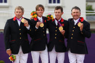 LONDON, ENGLAND - AUGUST 06: (L-R) Gold medalists Nick Skelton, Ben Maher, Scott Brash and Peter Charles of Great Britain celebrate on the podium during the medal ceremony for the Team Jumping on Day 10 of the London 2012 Olympic Games at Greenwich Park on August 6, 2012 in London, England. (Photo by Alex Livesey/Getty Images)