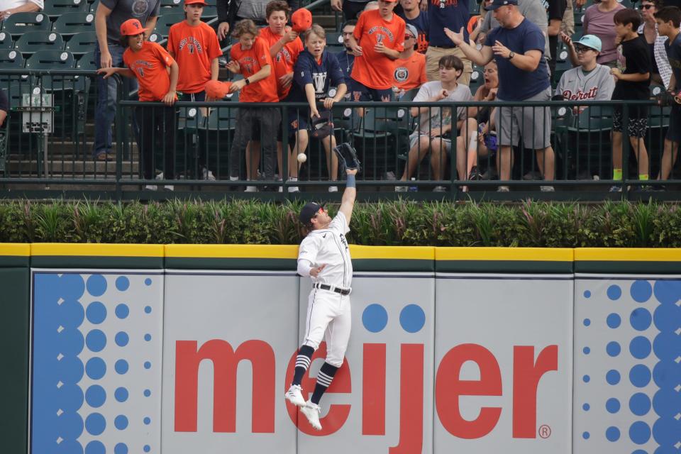 Detroit Tigers right fielder Zach McKinstry jumps and misses a home run hit by Corbin Carroll during the first inning at Comerica Park in Detroit on Friday, June 9, 2023.