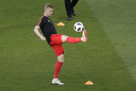 <p>Belgium and Manchester City star Kevin De Bruyne warms up ahead of the match </p>