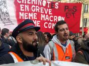French SNCF railway workers on strike attend a demonstration in Paris