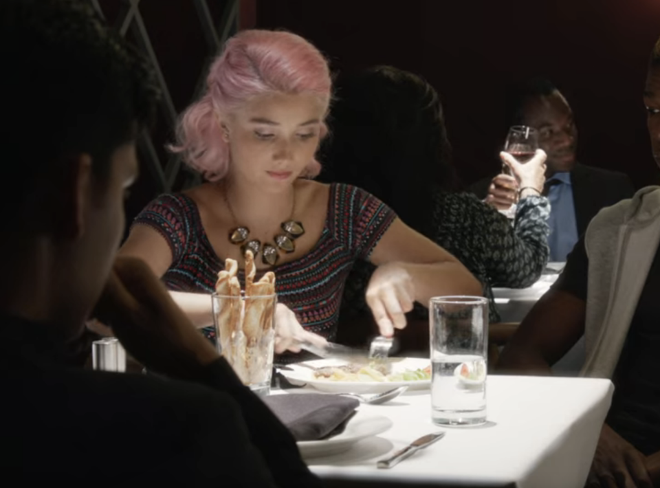 A woman eating a fancy dinner