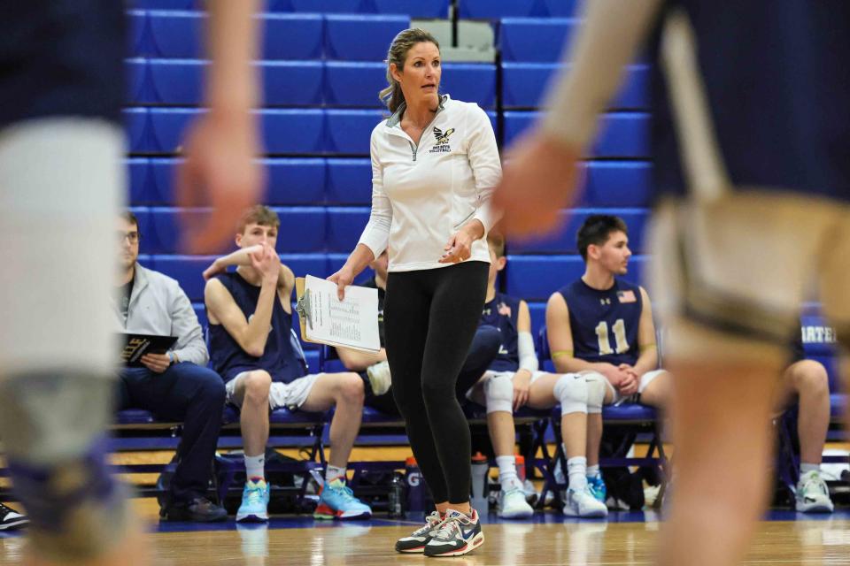 DMA Head Volleyball Coach Jen Johnson walks the sidelines during a regular season match between Charter School of Wilmington and Delaware Military Academy on Friday March 31, 2023.