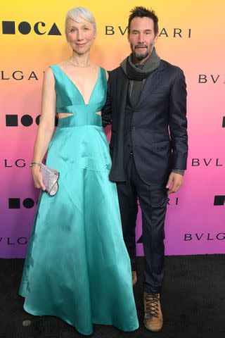 <p>Charley Gallay/Getty </p> Reeves and Grant pictured together at the MOCA Gala in April