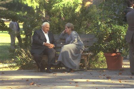 Israel's Foreign Minister Ariel Sharon (L) sits on a bench with U.S. Secretary of State Madeleine Albright during the Middle East peace summit at the Wye River Conference Centre in this handout file picture taken October 18, 1998 and and obtained by Reuters from the Israeli Government Press Office (GPO). REUTERS/Avi Ohayon/GPO/Handout/Files