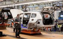 Stellantis assembly workers work on assembling the 2021 Jeep Grand Cherokee L