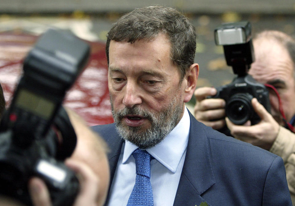 FILE This Wednesday Nov. 2, 2005 file photo shows Britain's former Secretary of State for Work and Pensions, David Blunkett, arriving at the Foreign Press Association in central London for a press conference where he announced his resignation from the post. On Tuesday, July 24, 2012, British prosecutors announced charges against eight people alleged to have been involved in a phone hacking scheme with more than 600 targets. Some of the prominent alleged victims of the phone hacking are thought to have included, Paul McCartney, Heather Mills, Angelina Jolie, Brad Pitt, Jude Law, Sadie Frost, Sienna Miller, Wayne Rooney, Sven-Goran Eriksson, Lord Frederick Windsor, John Prescott, as well as murdered 13-year old school girl who was abducted in 2002 Amanda "Milly" Dowler. (AP Photo/Jane Mingay, File)