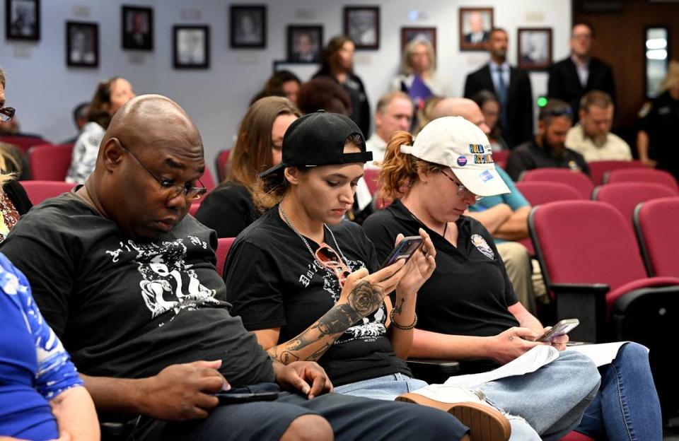 Representatives of Women’s Voices of Southwest Florida sit in the gallery during a Board of County Commissioners meeting on Tuesday, Sept. 12, 2023.