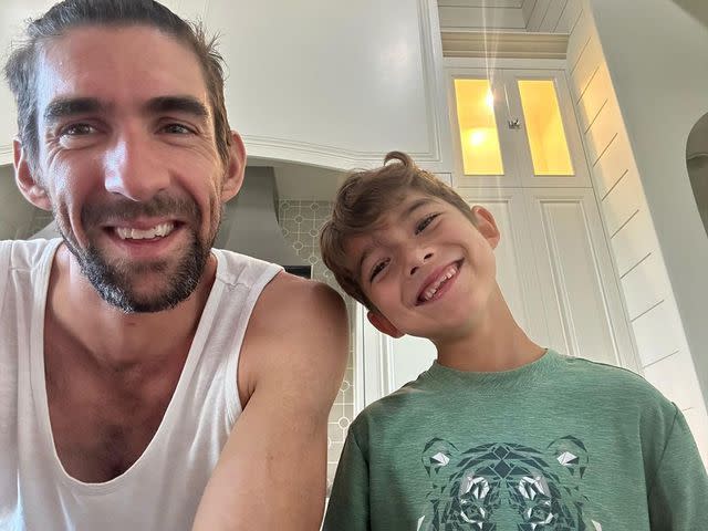 <p>Michael Phelps Instagram</p> Michael Phelps and Boomer Phelps