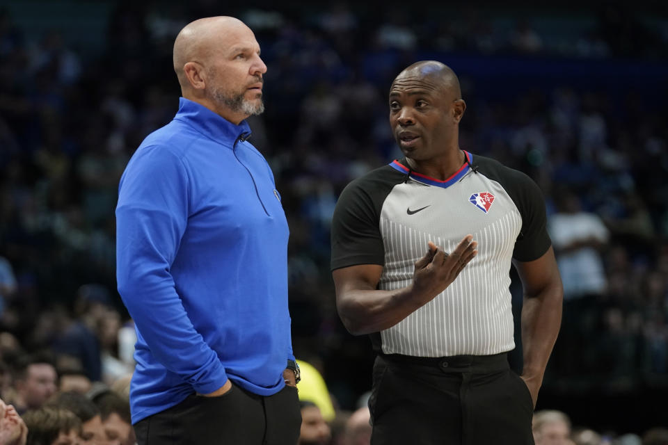 Dallas Mavericks head coach Jason Kidd, left, talks with referee Courtney Kirkland (61) during the first half of Game 6 of an NBA basketball second-round playoff series against the Phoenix Suns, Thursday, May 12, 2022, in Dallas. (AP Photo/Tony Gutierrez)