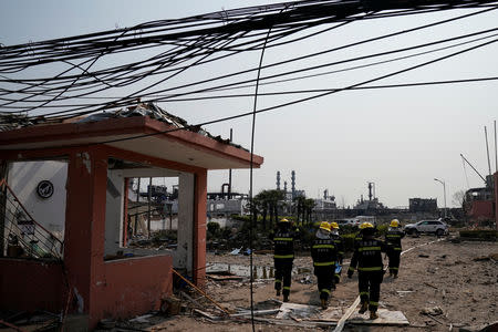 Firefighters enter the site following an explosion at a pesticide plant owned by Tianjiayi Chemical, in Xiangshui county, Yancheng, Jiangsu province, China March 23, 2019. REUTERS/Aly Song