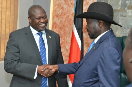 South Sudan's President Salva Kiir (right) shake hands with rebel leader Riek Machar in a rare September 2019 meeting in Juba