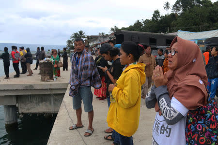 A woman prays for her son, a passenger on the KM Sinar Bangun ferry which sank yesterday in Lake Toba, in Simalungun, North Sumatra, Indonesia June 19, 2018 in this photo taken by Antara Foto. Antara Foto/Irsan Mulyadi/ via REUTERS