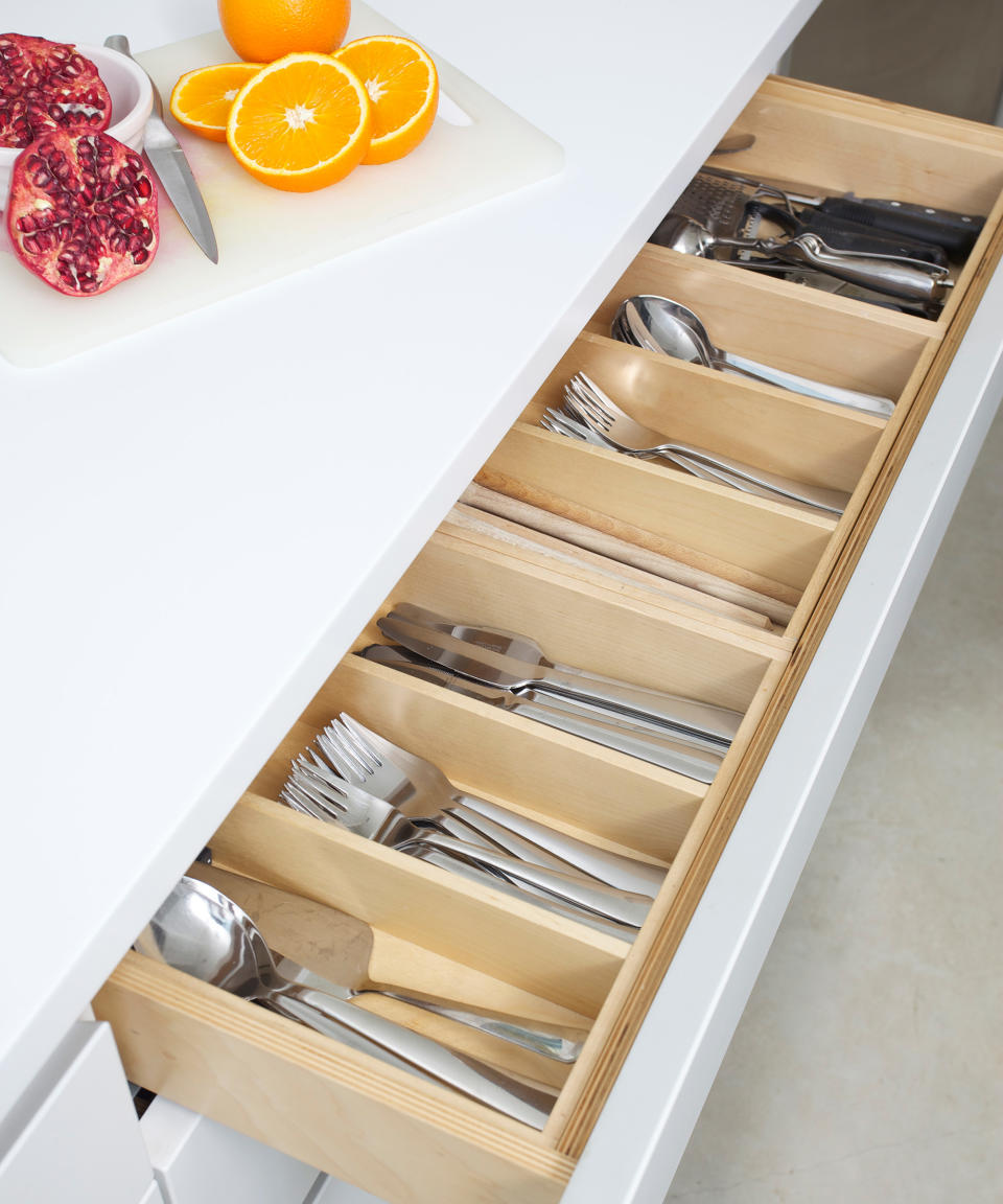 <p> If you&apos;re wondering how to organize a kitchen, your cupboards and drawers are your biggest storage resource but it&#x2019;s likely that they&#x2019;re not being used fully.&#xA0; </p> <p> Internal kitchen storage solutions will make the most of them, so think about retrofitting wire racks that pull out of corners or slim cupboards, or using drawer dividers for utensils, cutlery, spices, pans or plates.&#xA0; </p> <p> &#x2018;To elevate your cutlery drawer consider integrated wooden dividers,&#x2019; says Ben Burbidge, managing director, Kitchen Makers. &#x2018;Opting to combine painted kitchen cabinet ideas and wood finishes creates a contemporary feel that will remain on trend for years to come.&#x2019; </p> <p> Boost your storage further with a mobile solution, such as a bar cart trolley or butcher&#x2019;s block on castors, or think about popping baskets or containers on top of your wall cupboards. Just keep a sturdy stool nearby so you can reach them. </p>